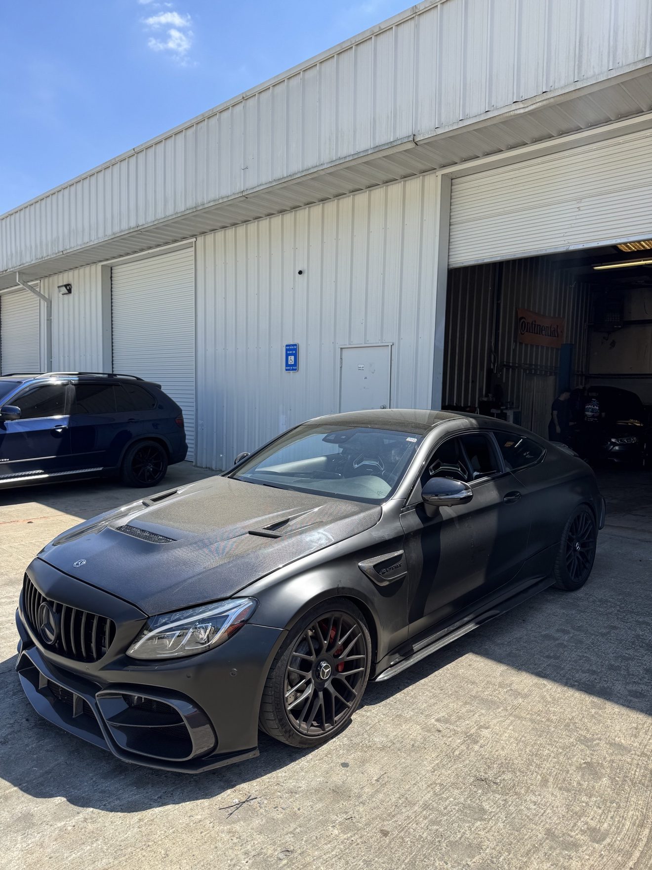 Matte black Mercedes-AMG C63 coupe at Auto Haus Solutions in Cumming, GA