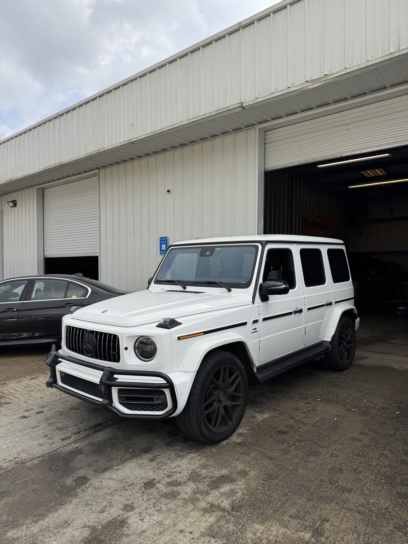 White Mercedes-AMG G63 G-Wagon at Auto Haus Solutions in Cumming, GA