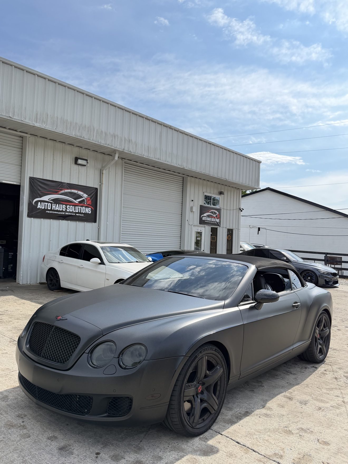 Matte black Bentley Continental GT convertible at Auto Haus Solutions in Cumming, GA