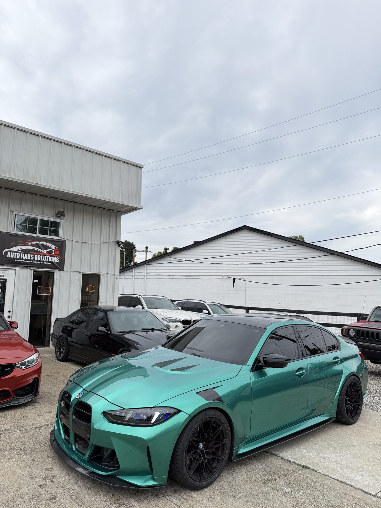 Teal BMW M3 sedan at Auto Haus Solutions