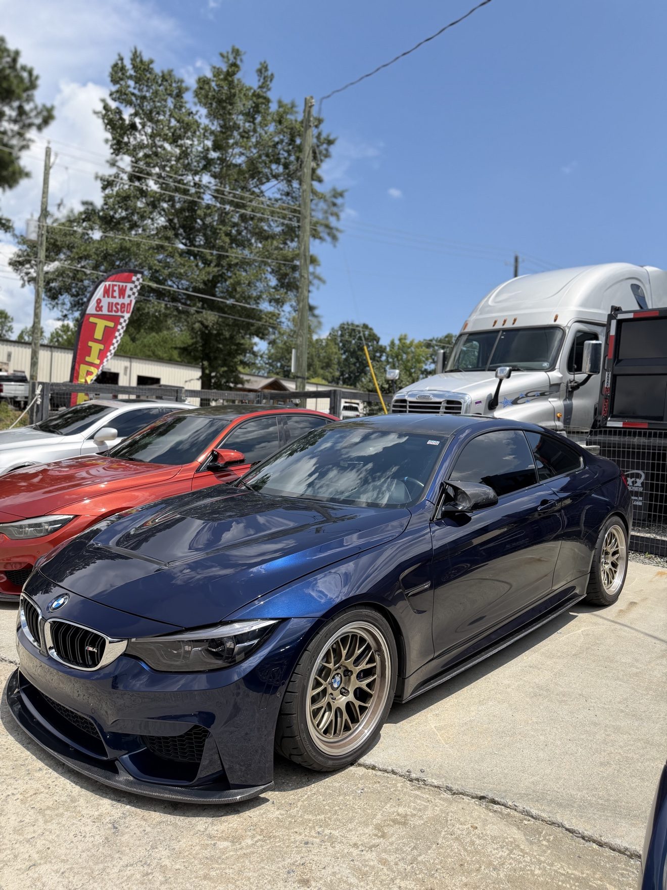 Dark blue BMW M4 coupe at Auto Haus Solutions in Cumming, GA