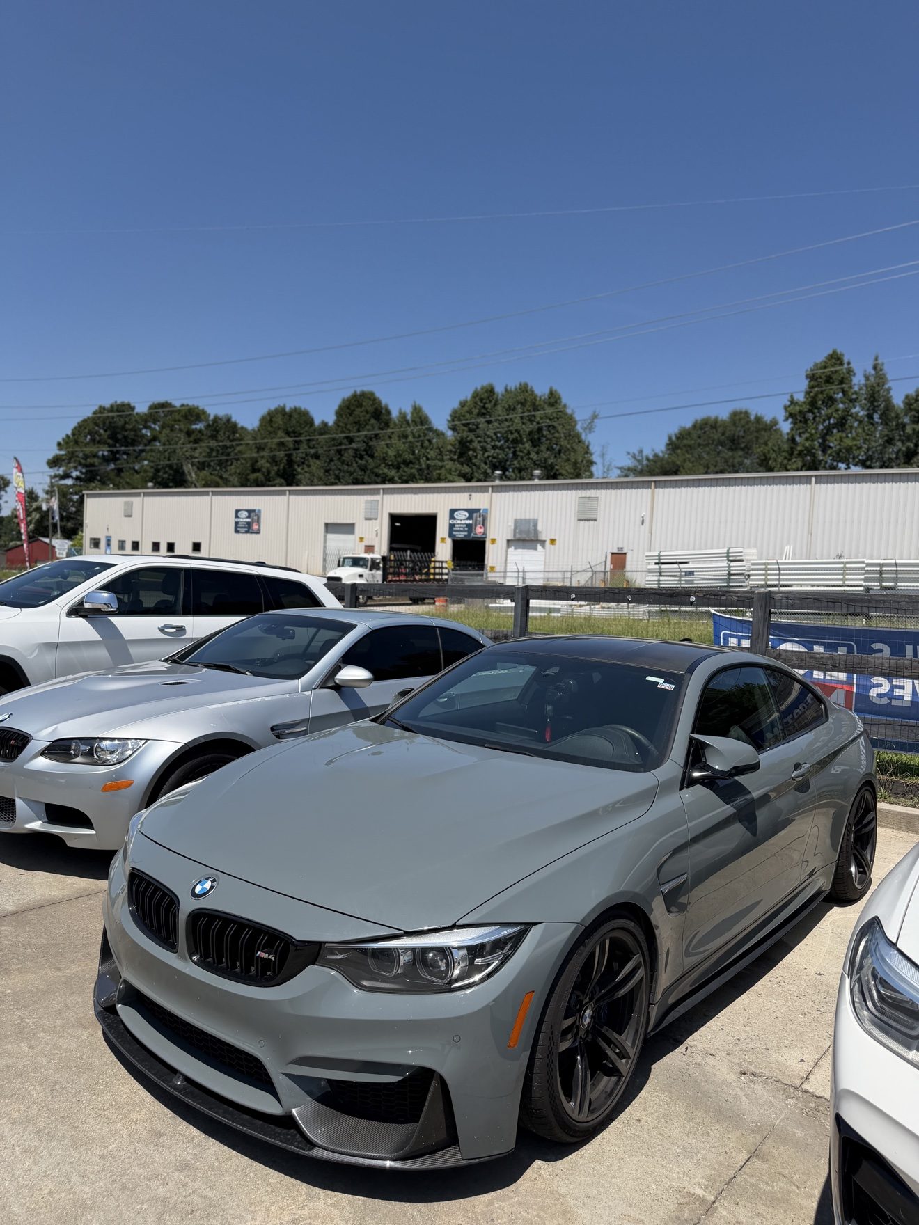 Gray BMW M4 coupe at Auto Haus Solutions