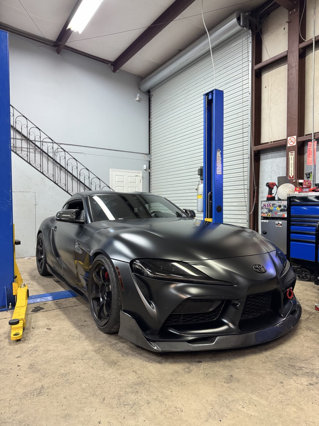 Matte black Toyota Supra in the service bay at Auto Haus Solutions in Cumming, GA
